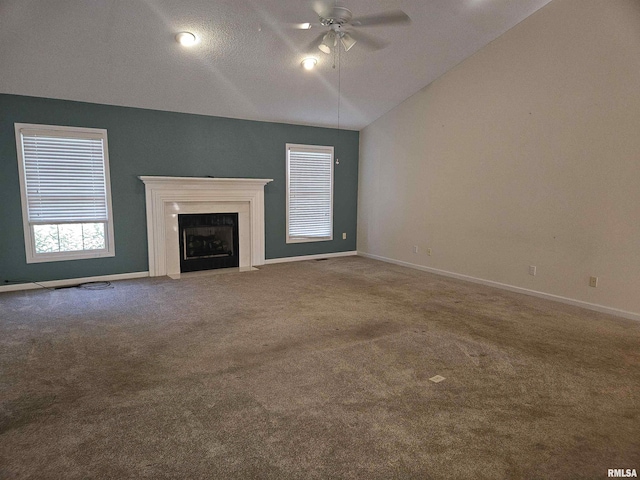 1905 N Dawn Dr, Marion, IL 62959 - unfurnished living room with vaulted ceiling, ceiling fan, carpet floors, and a fireplace with flush hearth