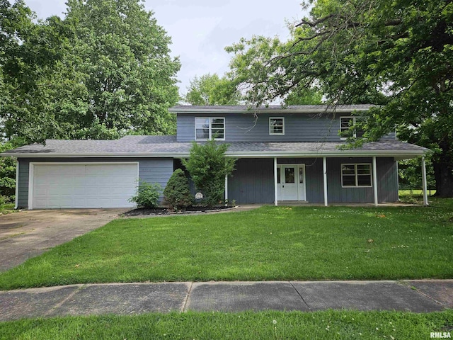 2908 W Kent Dr, Carbondale, IL 62901 - view of front of home with concrete driveway, an attached garage, a front yard, and a porch