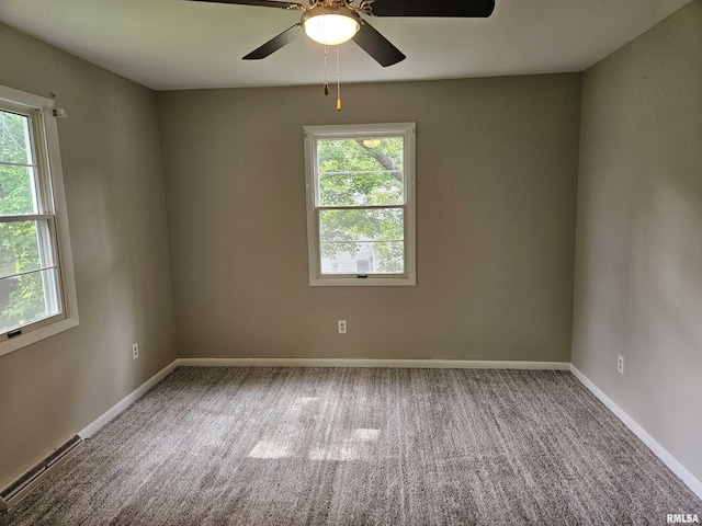 2908 W Kent Dr, Carbondale, IL 62901 - unfurnished room featuring healthy amount of natural light, a ceiling fan, and carpet flooring