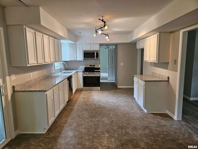 2908 W Kent Dr, Carbondale, IL 62901 - kitchen with appliances with stainless steel finishes, light stone counters, white cabinetry, and dark stone finish floors