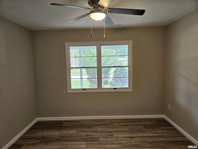 2908 W Kent Dr, Carbondale, IL 62901 - empty room featuring dark wood-type flooring and a ceiling fan