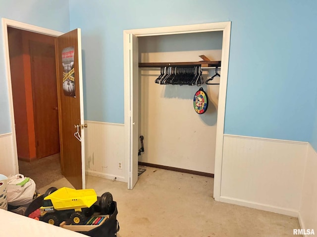 24 Adkins St, Metropolis, IL 62960 - bedroom with a wainscoted wall, a closet, and carpet floors