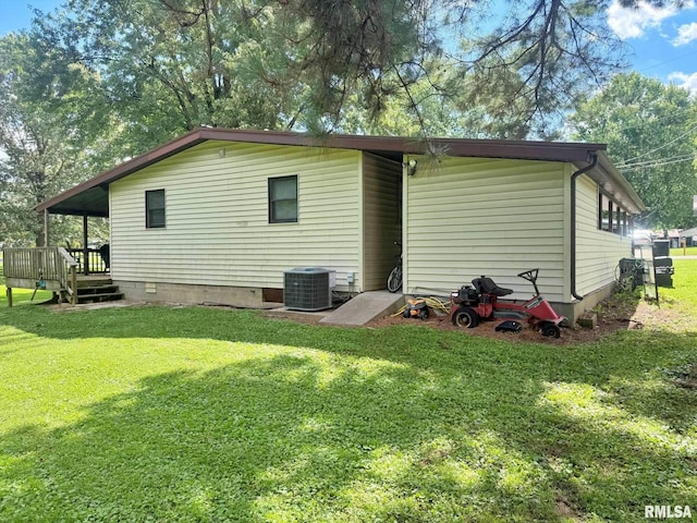 24 Adkins St, Metropolis, IL 62960 - rear view of property featuring a wooden deck, a lawn, and crawl space