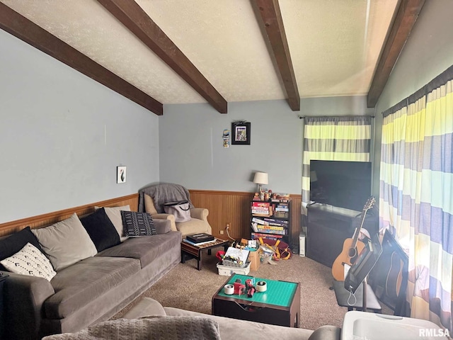 24 Adkins St, Metropolis, IL 62960 - carpeted living room with beamed ceiling, a wainscoted wall, and wood walls
