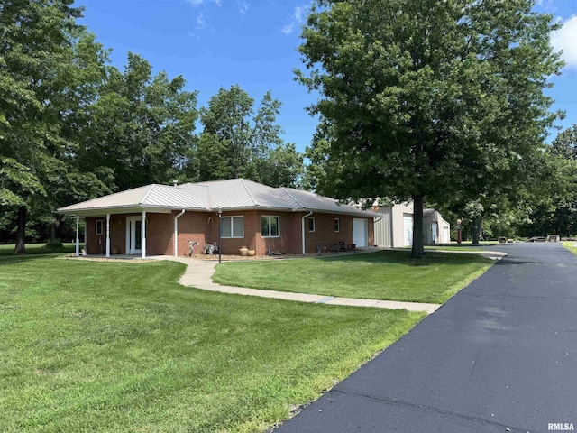 1308 Shawnee Trl, Carterville, IL 62918 - single story home featuring a front yard, a garage, and brick siding