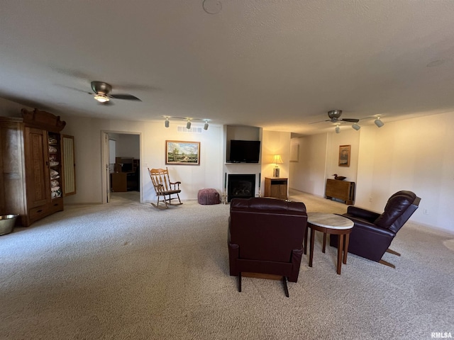 1308 Shawnee Trl, Carterville, IL 62918 - living area with a ceiling fan, light colored carpet, and a fireplace
