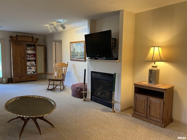 1308 Shawnee Trl, Carterville, IL 62918 - carpeted living room with a glass covered fireplace and baseboards