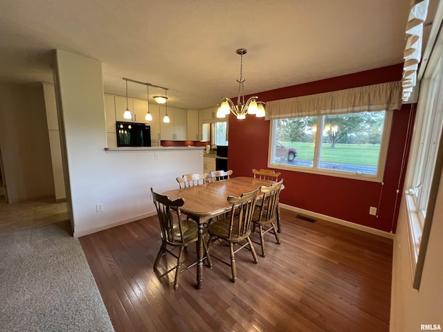 1308 Shawnee Trl, Carterville, IL 62918 - dining space featuring wood finished floors and a chandelier