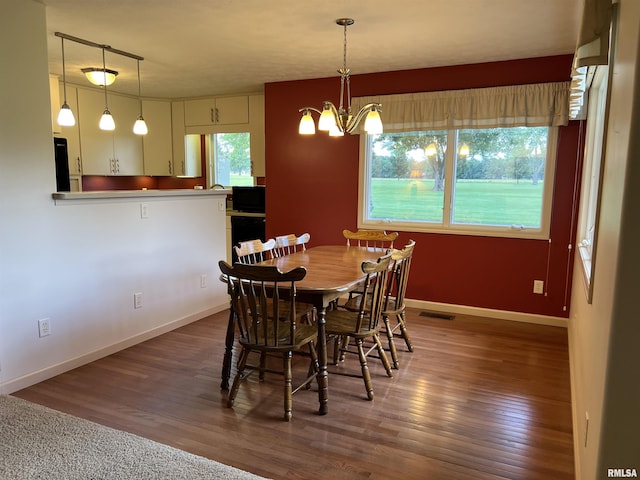 1308 Shawnee Trl, Carterville, IL 62918 - dining space featuring wood finished floors and a chandelier