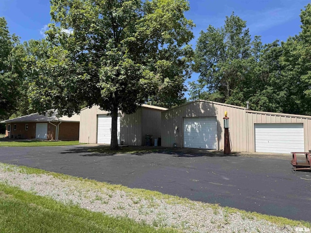 1308 Shawnee Trl, Carterville, IL 62918 - view of front facade with an outbuilding and a garage