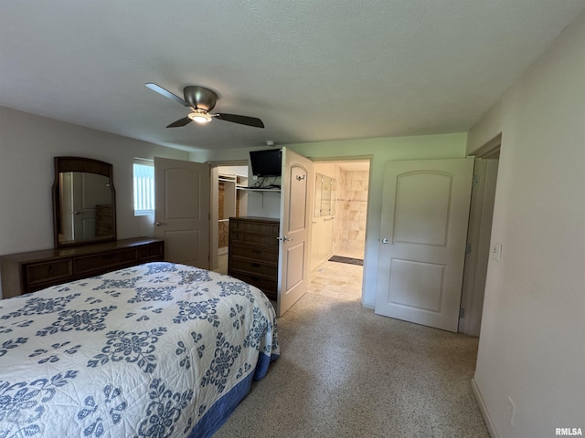 1308 Shawnee Trl, Carterville, IL 62918 - bedroom featuring a spacious closet, a ceiling fan, a closet, connected bathroom, and a textured ceiling