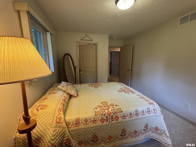 1308 Shawnee Trl, Carterville, IL 62918 - bedroom with carpet flooring and a textured ceiling