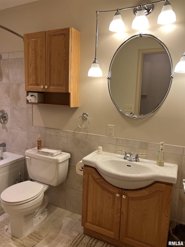 1308 Shawnee Trl, Carterville, IL 62918 - full bathroom with tile walls, vanity, washtub / shower combination, and wainscoting