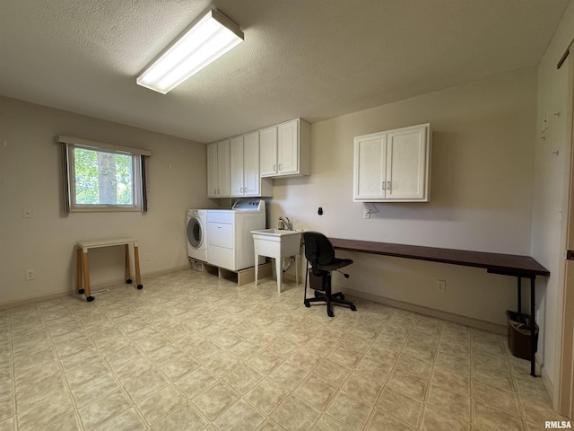 1308 Shawnee Trl, Carterville, IL 62918 - washroom featuring washer and dryer, cabinet space, a textured ceiling, and a desk