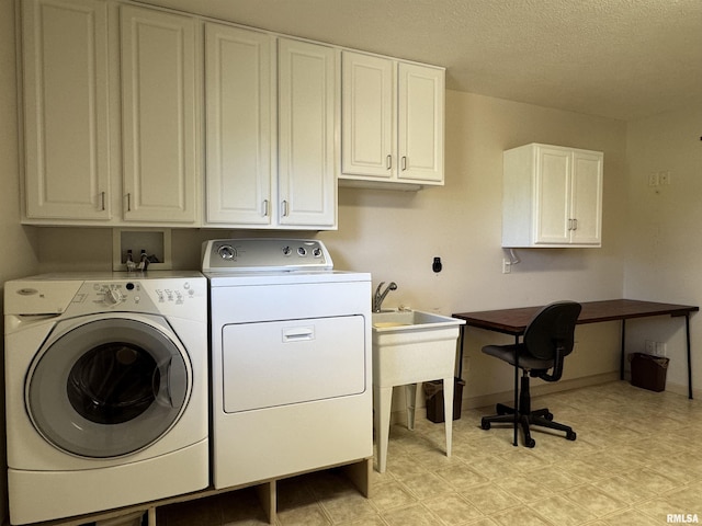 1308 Shawnee Trl, Carterville, IL 62918 - washroom with washing machine and clothes dryer, cabinet space, and a textured ceiling