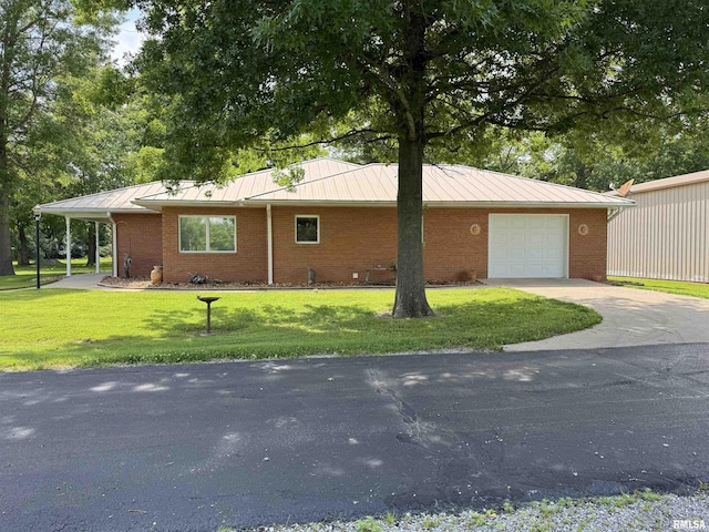 1308 Shawnee Trl, Carterville, IL 62918 - view of side of home featuring driveway, a standing seam roof, and a yard