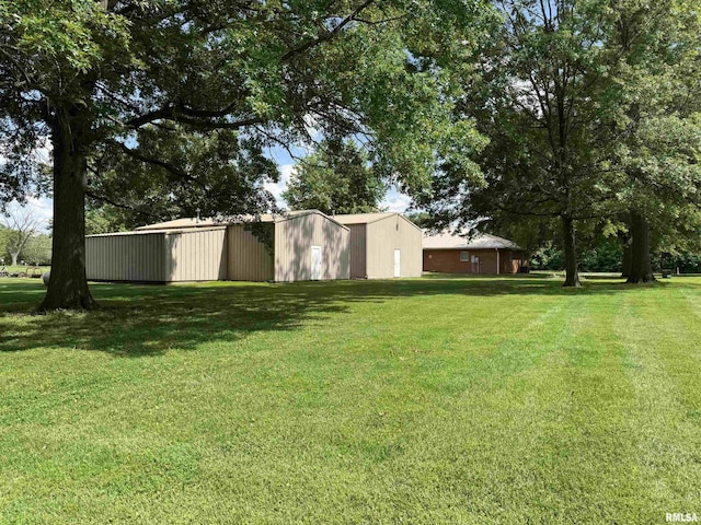 1308 Shawnee Trl, Carterville, IL 62918 - view of grassy yard featuring a pole building and an outdoor structure