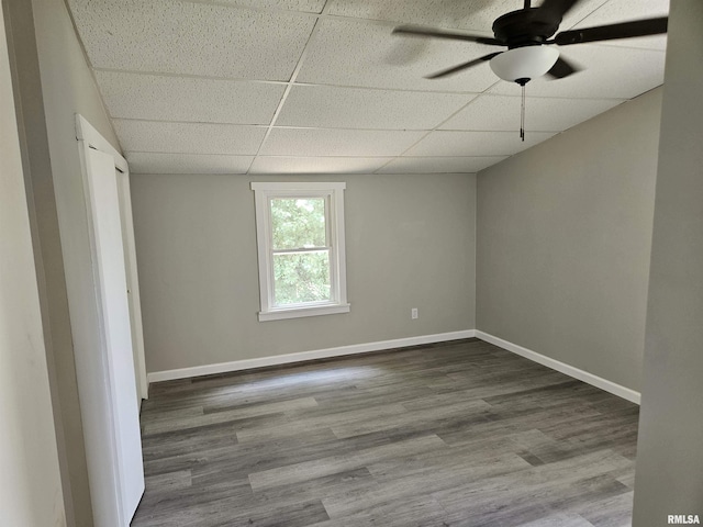 1206 N 14th St, Murphysboro, IL 62966 - spare room featuring a paneled ceiling, wood finished floors, and a ceiling fan