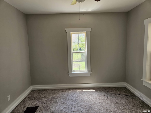 1206 N 14th St, Murphysboro, IL 62966 - empty room featuring dark colored carpet and a ceiling fan