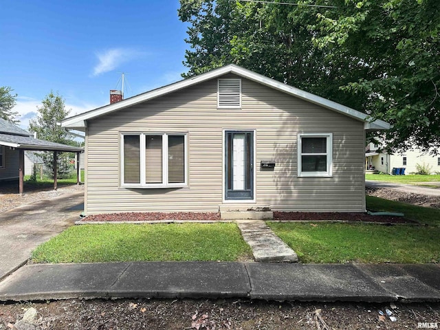 215 S Sunny Slope St, West Frankfort, IL 62896 - bungalow with a front yard and a chimney