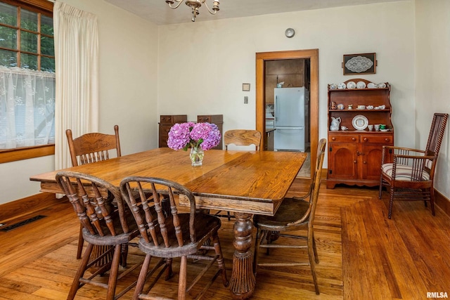 2011 Logan St, Murphysboro, IL 62966 - dining space featuring wood finished floors and a chandelier