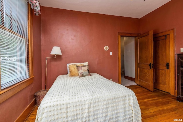 2011 Logan St, Murphysboro, IL 62966 - bedroom with multiple windows and wood finished floors