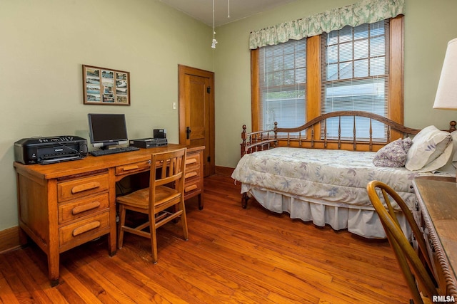 2011 Logan St, Murphysboro, IL 62966 - bedroom with wood finished floors and an office area