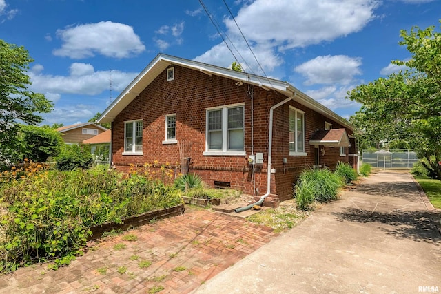 2011 Logan St, Murphysboro, IL 62966 - view of property exterior with brick siding and driveway