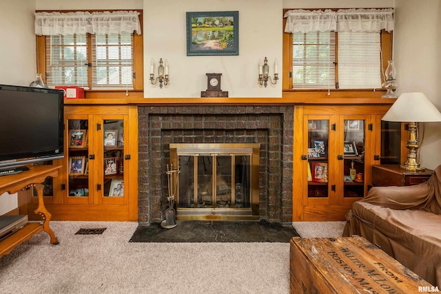 2011 Logan St, Murphysboro, IL 62966 - carpeted living area featuring a brick fireplace