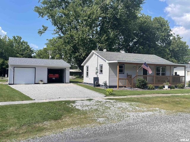 204 Oak St, Odin, IL 62870 - single story home with an outdoor structure, a garage, a front lawn, and a porch