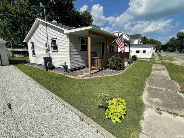 204 Oak St, Odin, IL 62870 - view of front of house with covered porch, a front yard, and crawl space