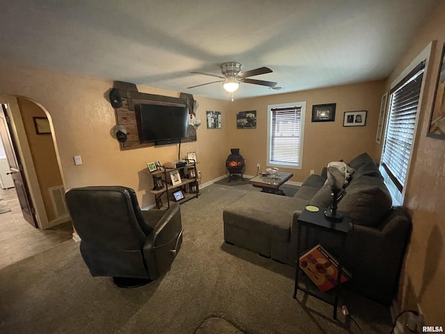 204 Oak St, Odin, IL 62870 - living room with arched walkways, a ceiling fan, and carpet floors