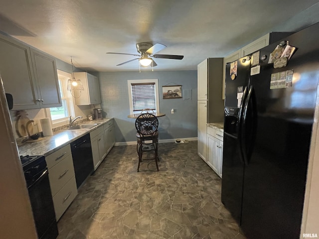204 Oak St, Odin, IL 62870 - kitchen with black appliances, dark stone finish flooring, ceiling fan, and light countertops