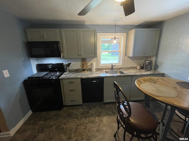 204 Oak St, Odin, IL 62870 - kitchen featuring black appliances, ceiling fan, dark stone finish flooring, and decorative light fixtures