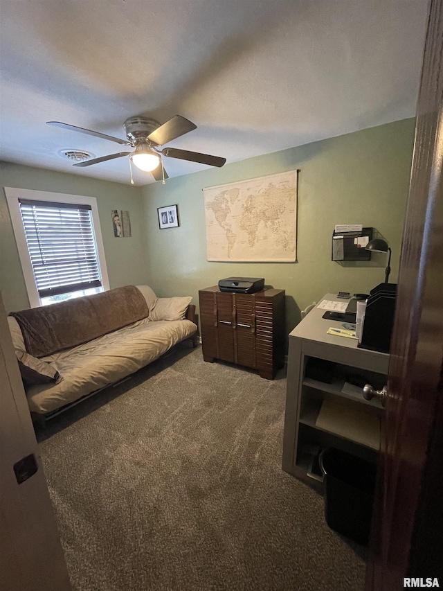204 Oak St, Odin, IL 62870 - carpeted bedroom with a desk and a ceiling fan