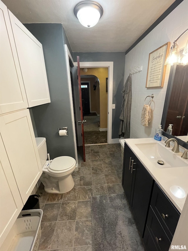 204 Oak St, Odin, IL 62870 - bathroom featuring vanity and stone finish floors