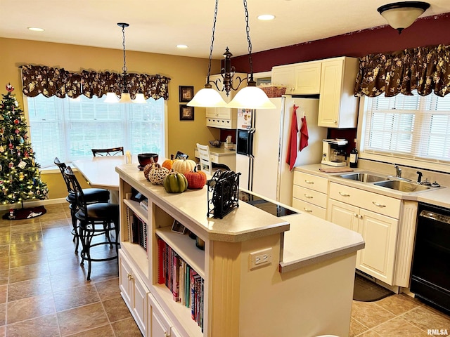 43 E Lakewood Dr, Metropolis, IL 62960 - kitchen featuring healthy amount of natural light, black appliances, a kitchen island, decorative light fixtures, and recessed lighting