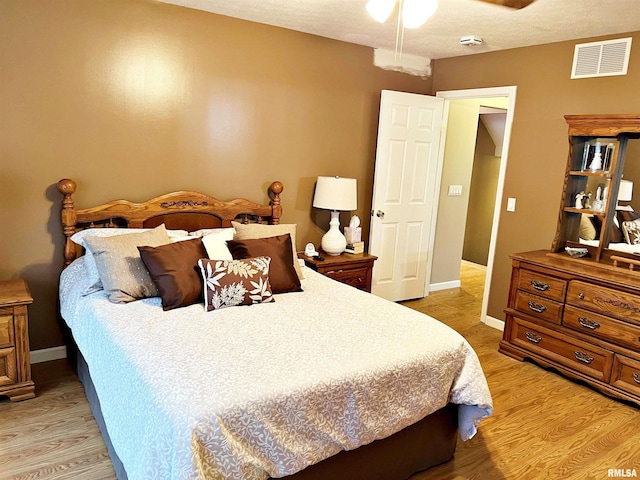 43 E Lakewood Dr, Metropolis, IL 62960 - bedroom featuring light wood-style flooring and ceiling fan