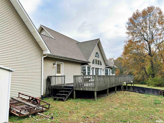 43 E Lakewood Dr, Metropolis, IL 62960 - back of property featuring roof with shingles, a deck, and a lawn