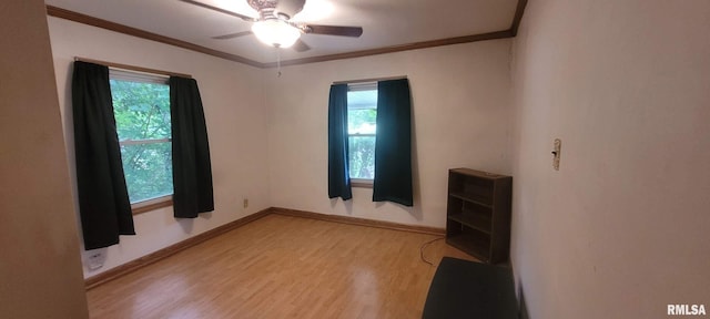 1412 N 11th St, Mount Vernon, IL 62864 - empty room with wood finished floors, ceiling fan, and ornamental molding