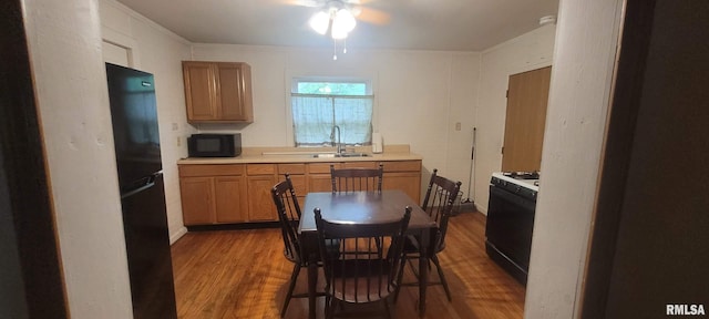 1412 N 11th St, Mount Vernon, IL 62864 - kitchen with black appliances, dark wood-style floors, ceiling fan, and light countertops