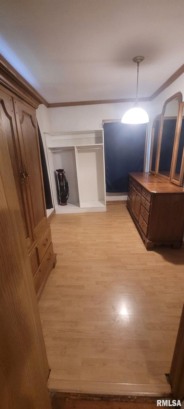 1412 N 11th St, Mount Vernon, IL 62864 - unfurnished bedroom with crown molding and light wood-type flooring