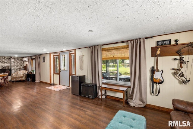468 Clifty Heights Dr, Marion, IL 62959 - living room with a textured ceiling, a brick fireplace, and dark wood finished floors