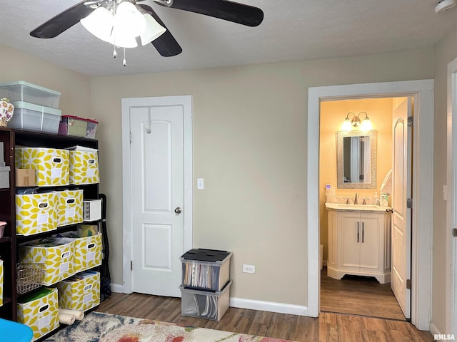 501 Cedar Creek Rd, Makanda, IL 62958 - bedroom featuring wood finished floors, ensuite bath, and ceiling fan