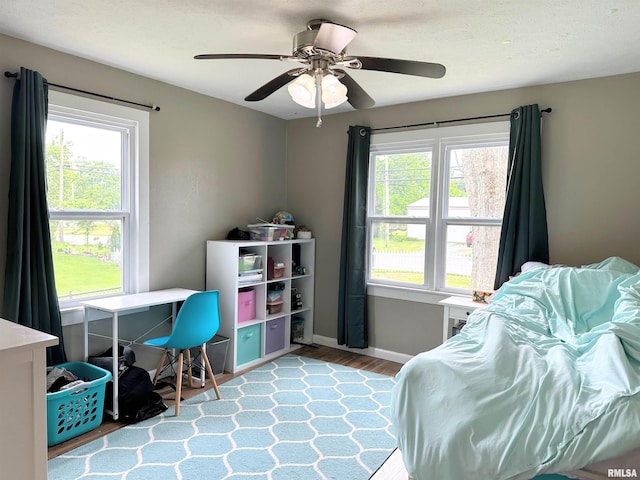 501 Cedar Creek Rd, Makanda, IL 62958 - bedroom featuring multiple windows, wood finished floors, and ceiling fan