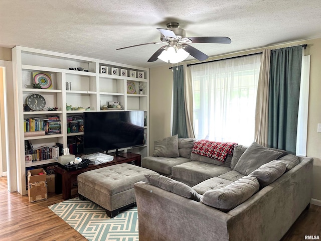 501 Cedar Creek Rd, Makanda, IL 62958 - living room with wood finished floors, a ceiling fan, and a textured ceiling