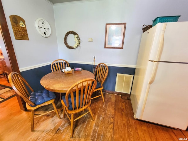113 SW Mead St, Clay City, IL 62824 - dining area with wood finished floors and crown molding