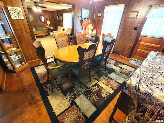113 SW Mead St, Clay City, IL 62824 - dining space featuring wooden walls, wood finished floors, and ceiling fan