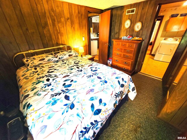113 SW Mead St, Clay City, IL 62824 - carpeted bedroom featuring washer / dryer and wooden walls