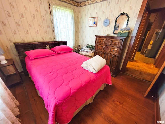 113 SW Mead St, Clay City, IL 62824 - bedroom with wallpapered walls and wood finished floors